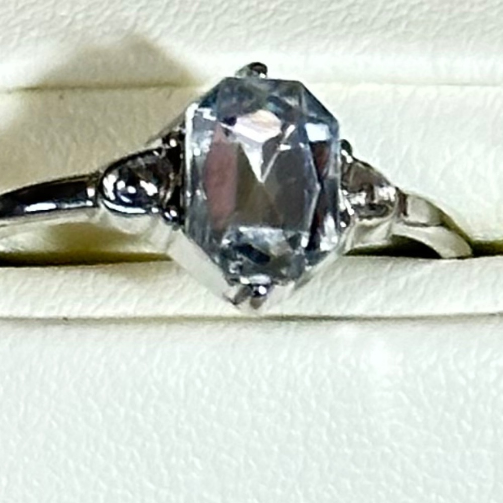 Silver ring w/Emerald cut Aquamarine & 2 clear round stones on sides